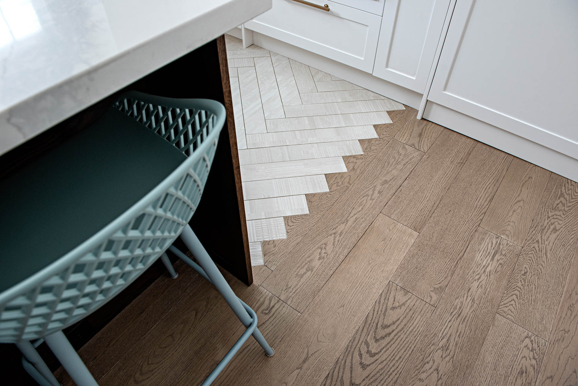 Modern farmhouse herringbone tile to wood floor transition