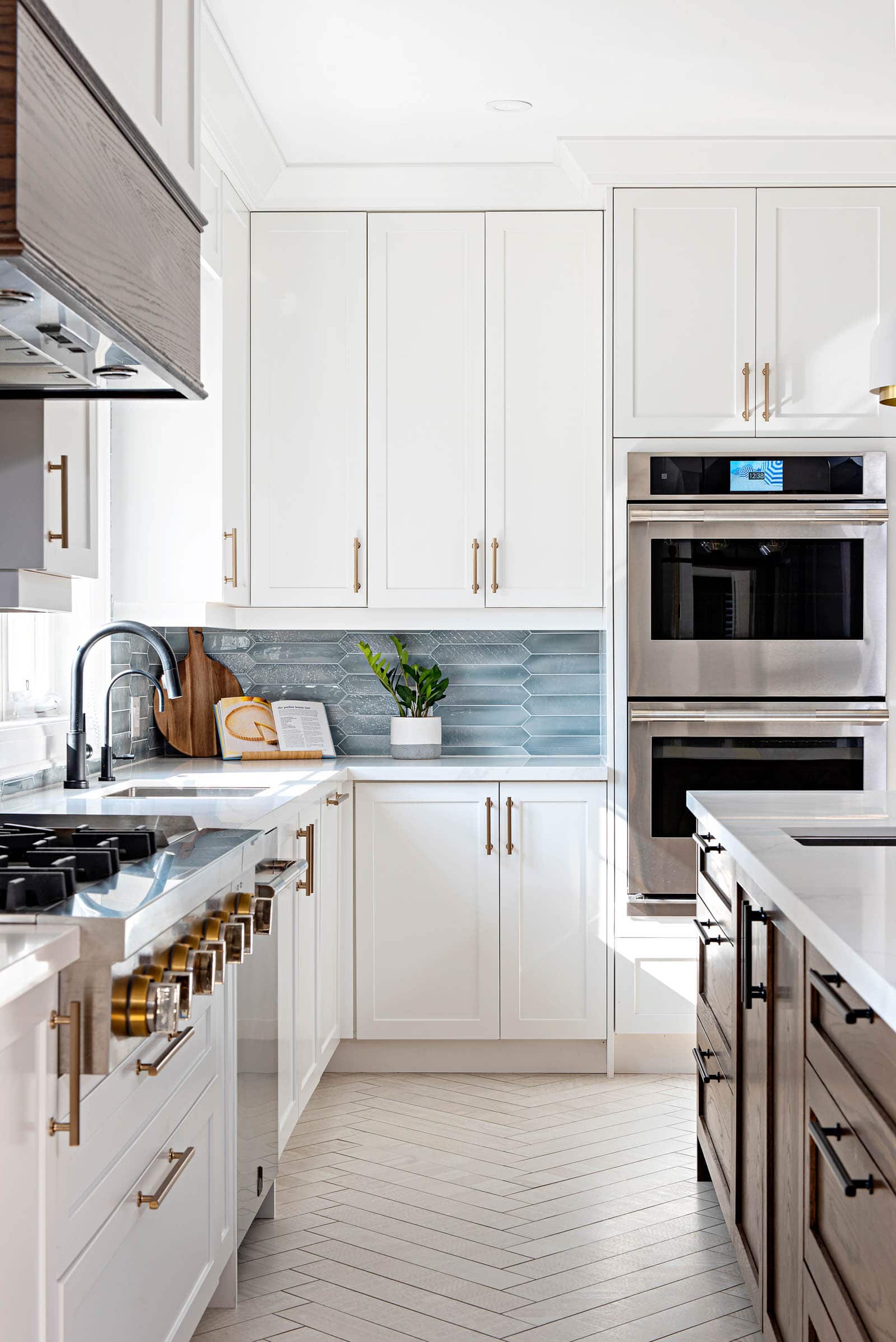 Modern farmhouse white kitchen design with aqua backsplash