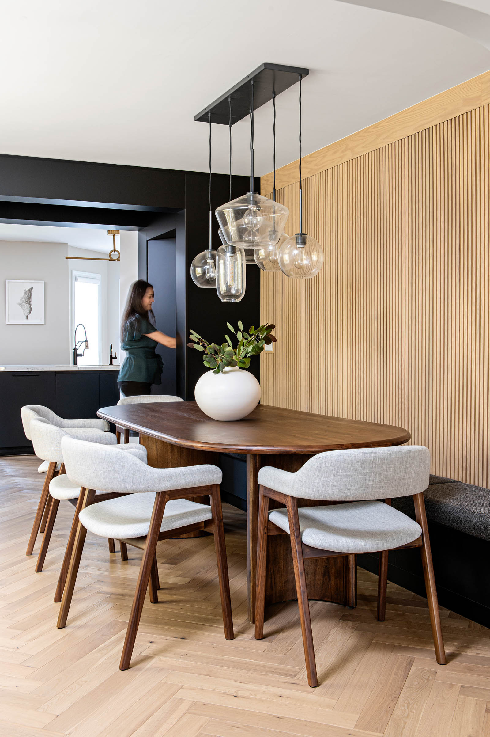 Image of Modern Dining Room view into kitchen and hidden pantry.