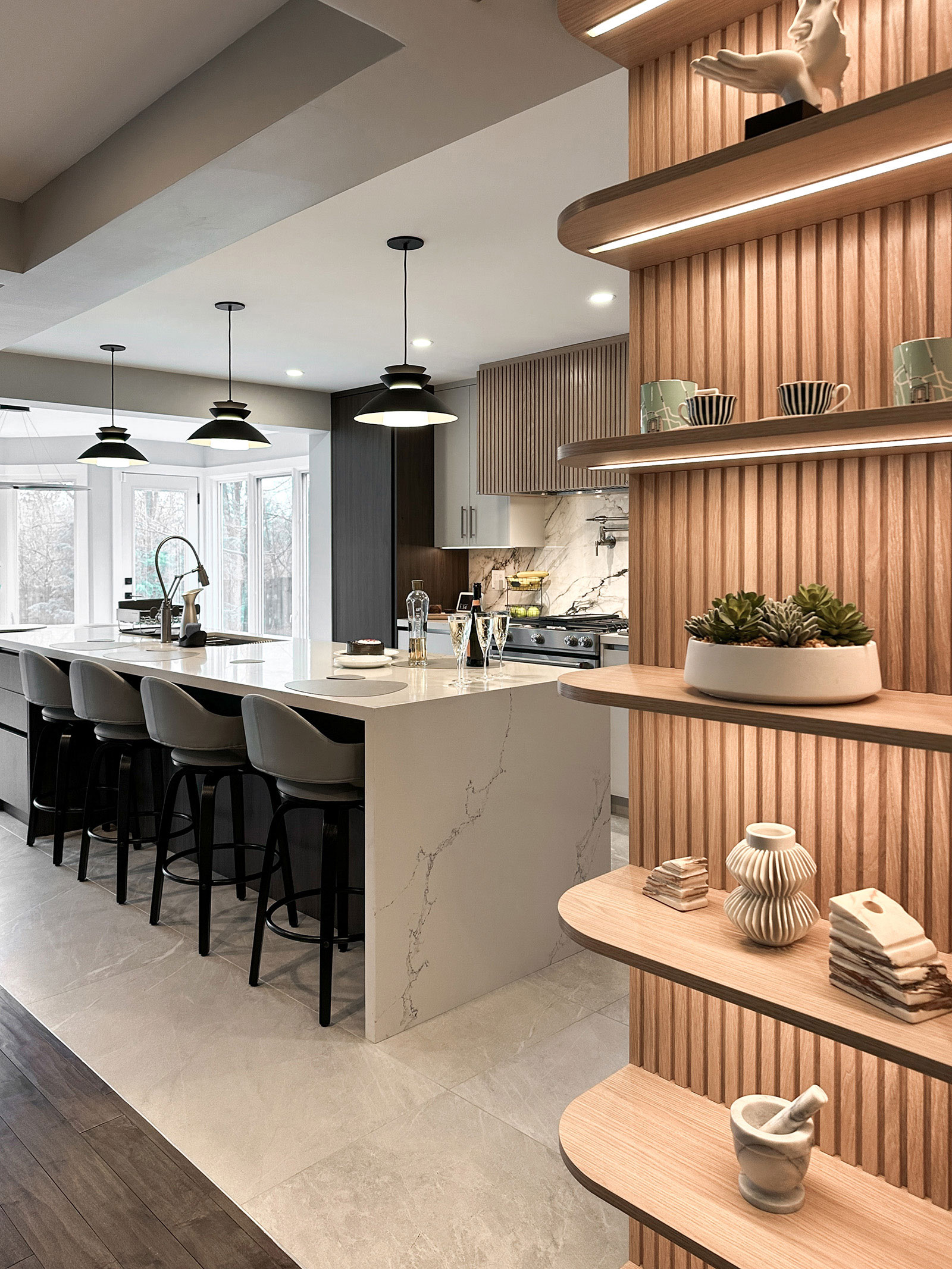 Modern open kitchen with quartz island and wooden shelving at Bayview Residence